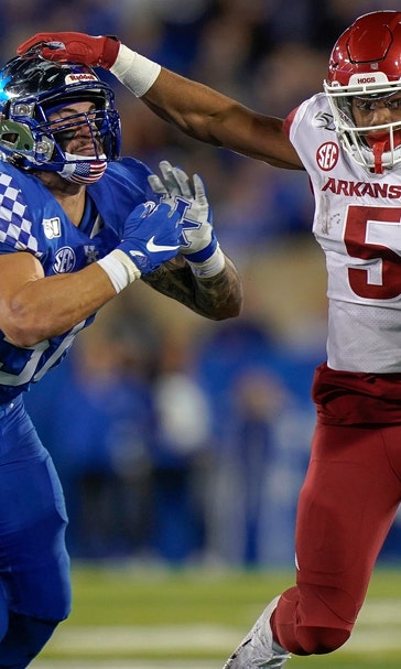 Lynn Bowden's 3 TDs rally Kentucky past Arkansas 24-20